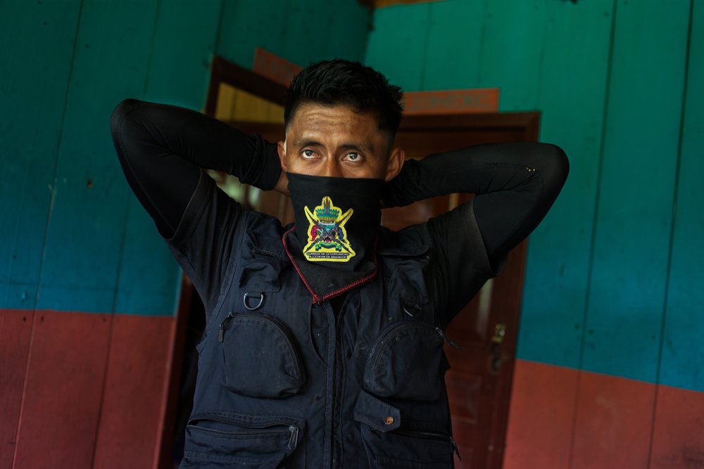 Edison Narvaez, a member of the Cofan indigenous guard, prepares to go on patrol at the village of Sinangoe, Ecuador, on April 21, 2022. Thomson Reuters Foundation/Fabio Cuttica