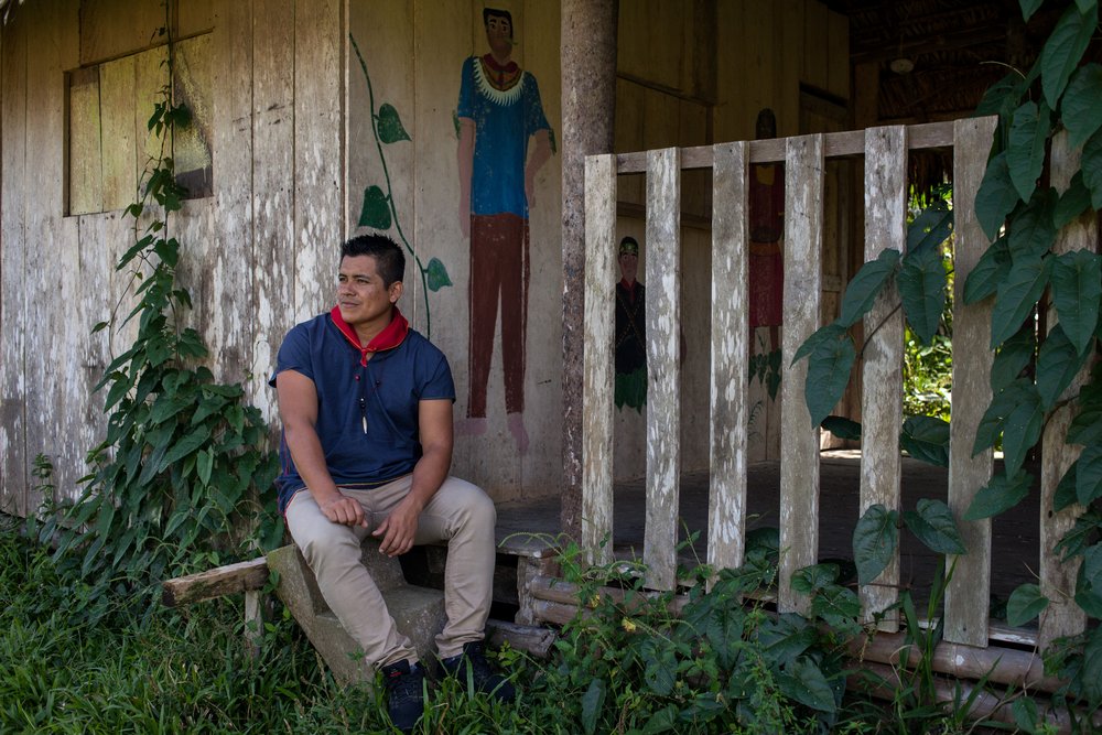 Cofan indigenous leader Wider Guaramag, part of a six-member elected committee that makes laws and guides the community, rests at the rainforest village of Sinangoe in northern Ecuador, on April 21, 2022. Thomson Reuters Foundation/Fabio Cuttica